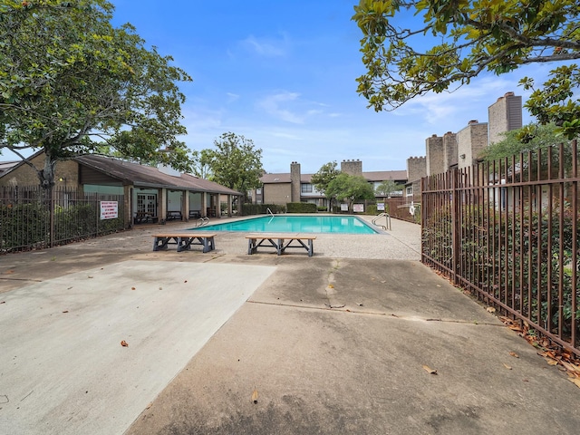 6633 W Airport Blvd Unit 1106, Houston, TX 77035 - community pool featuring a patio area