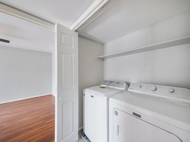 6633 W Airport Blvd Unit 1106, Houston, TX 77035 - laundry area featuring separate washer and dryer, light wood finished floors, and baseboards