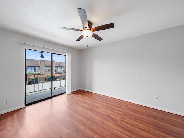 6633 W Airport Blvd Unit 1106, Houston, TX 77035 - unfurnished room featuring wood finished floors, a ceiling fan, and baseboards