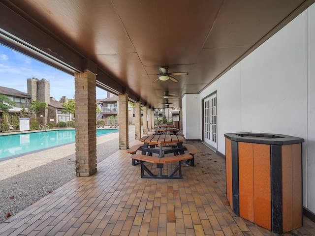 6633 W Airport Blvd Unit 1106, Houston, TX 77035 - view of patio / terrace featuring french doors, a community pool, and a ceiling fan