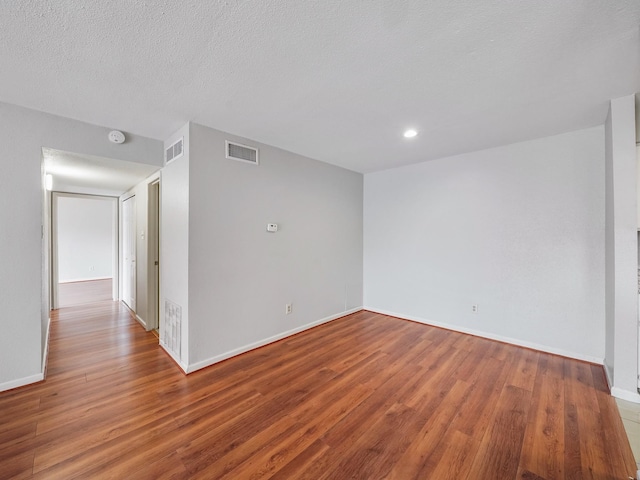 6633 W Airport Blvd Unit 1106, Houston, TX 77035 - unfurnished room with wood finished floors, baseboards, recessed lighting, and a smoke detector