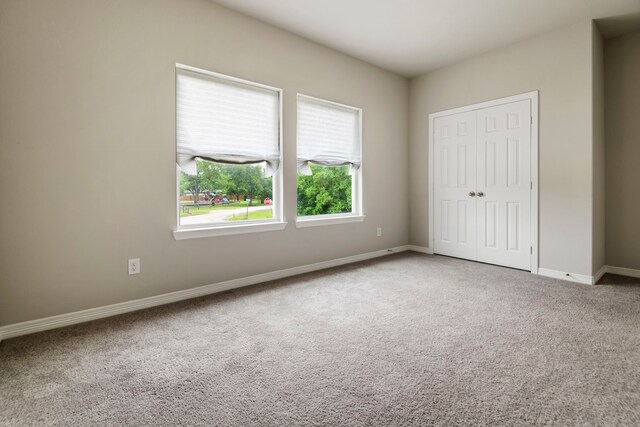 269 Bay Oaks Dr, La Porte, TX 77571 - unfurnished bedroom featuring carpet, baseboards, and a closet