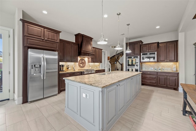 2410 Legends Way, Katy, TX 77493 - kitchen featuring appliances with stainless steel finishes, custom range hood, decorative backsplash, a sink, and dark brown cabinets