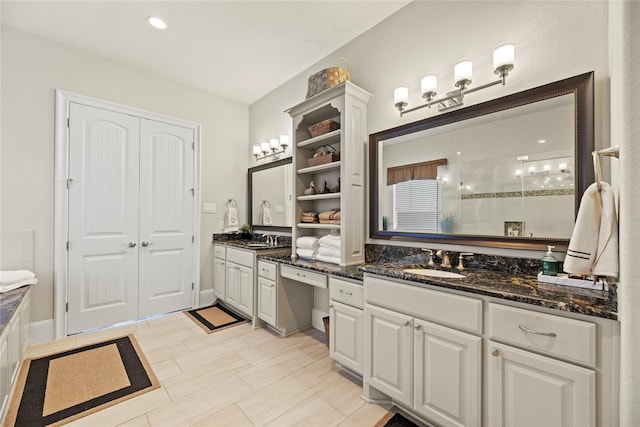 2410 Legends Way, Katy, TX 77493 - bathroom featuring vanity and a tile shower