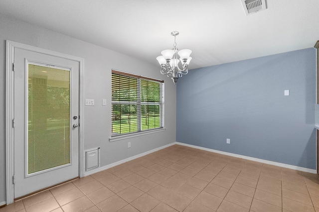 27017 Del Rio Trl W, Magnolia, TX 77355 - empty room featuring a chandelier, light tile patterned floors, and baseboards