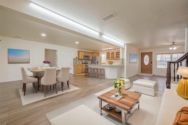 1407 Tiki Dr, Tiki Island, TX 77554 - living room with baseboards, light wood-style flooring, recessed lighting, and ceiling fan