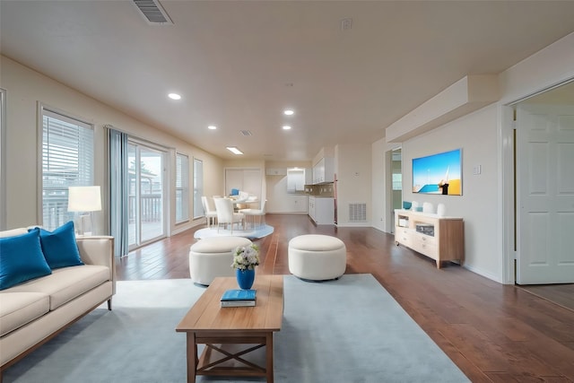 1407 Tiki Dr, Tiki Island, TX 77554 - living area featuring dark wood finished floors, recessed lighting, and baseboards