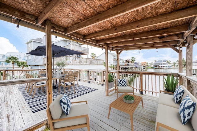 1407 Tiki Dr, Tiki Island, TX 77554 - deck with a residential view and a water view