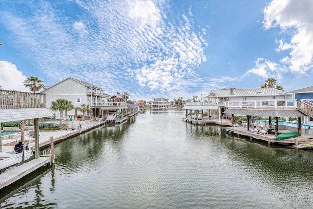1407 Tiki Dr, Tiki Island, TX 77554 - dock area with a water view and a residential view