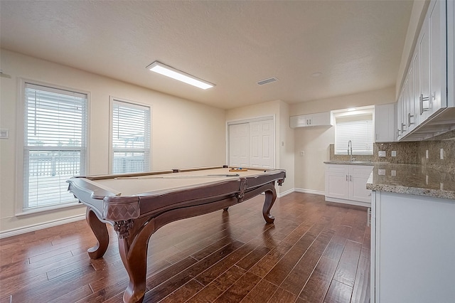 1407 Tiki Dr, Tiki Island, TX 77554 - rec room featuring baseboards, billiards, dark wood-style flooring, and a sink