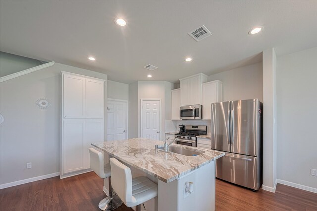 3813 Kirby Ct, Texas City, TX 77591 - kitchen featuring appliances with stainless steel finishes, baseboards, a sink, dark wood finished floors, and recessed lighting