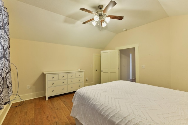 1809 31st St, Galveston, TX 77550 - bedroom with vaulted ceiling, wood finished floors, baseboards, and ceiling fan