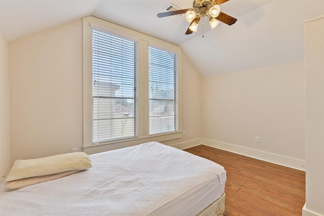1809 31st St, Galveston, TX 77550 - bedroom featuring vaulted ceiling, wood finished floors, baseboards, and ceiling fan