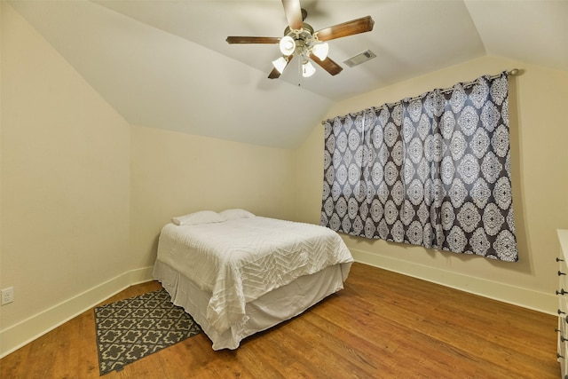 1809 31st St, Galveston, TX 77550 - bedroom with lofted ceiling, wood finished floors, a ceiling fan, and baseboards