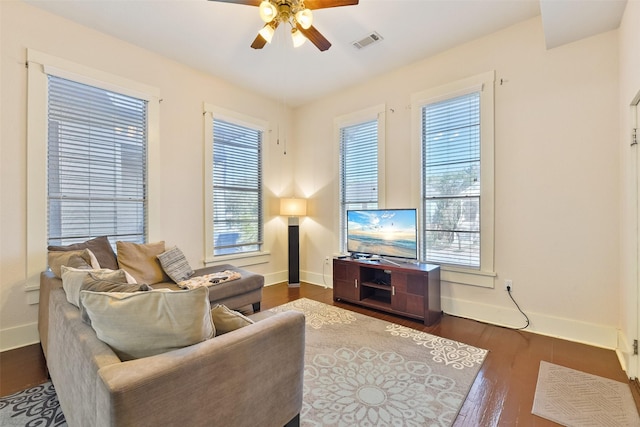 1809 31st St, Galveston, TX 77550 - living room with a ceiling fan, baseboards, and healthy amount of natural light
