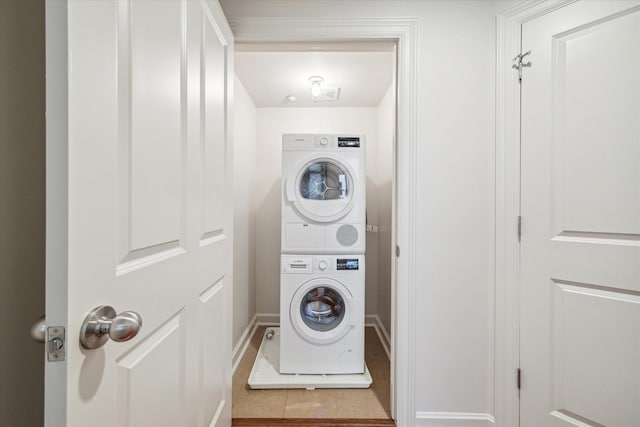 914 Main St Unit 1104, Houston, TX 77002 - laundry room featuring stacked washer / drying machine and baseboards