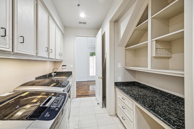 4 River Hollow Ln, Houston, TX 77027 - kitchen featuring a sink, white cabinetry, washing machine and clothes dryer, dark stone countertops, and open shelves