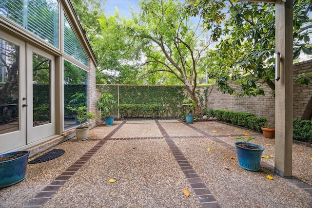 4 River Hollow Ln, Houston, TX 77027 - fenced backyard with a patio area and french doors