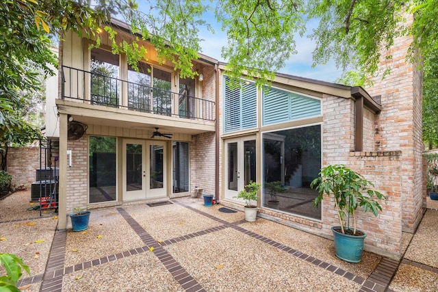 4 River Hollow Ln, Houston, TX 77027 - rear view of house with french doors, a balcony, brick siding, central AC, and ceiling fan