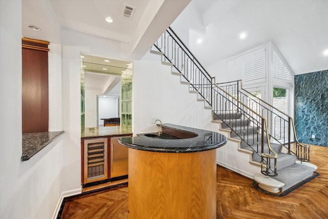 4 River Hollow Ln, Houston, TX 77027 - indoor wet bar with stairway, wine cooler, recessed lighting, and baseboards