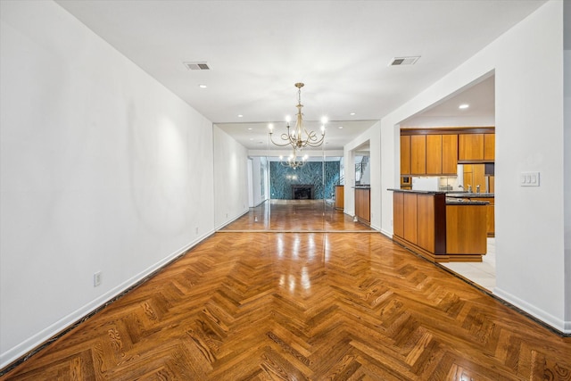 4 River Hollow Ln, Houston, TX 77027 - hallway with baseboards, a chandelier, and recessed lighting