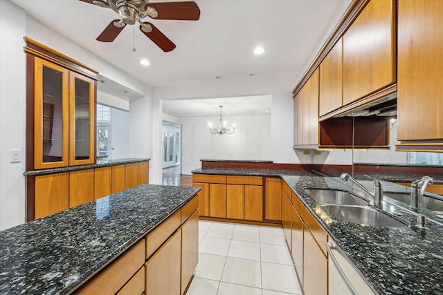 4 River Hollow Ln, Houston, TX 77027 - kitchen with a sink, a ceiling fan, brown cabinetry, a chandelier, and a peninsula