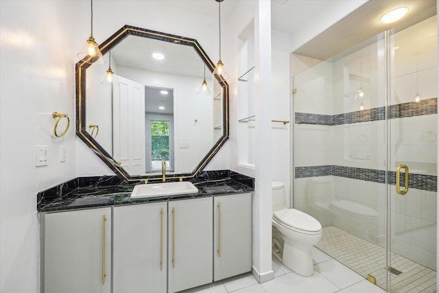 4 River Hollow Ln, Houston, TX 77027 - full bathroom with toilet, vanity, a shower stall, tile patterned flooring, and recessed lighting