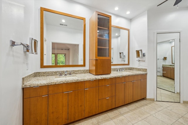 4 River Hollow Ln, Houston, TX 77027 - bathroom featuring double vanity, tile patterned flooring, a ceiling fan, and recessed lighting