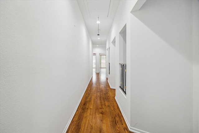 4 River Hollow Ln, Houston, TX 77027 - hall featuring attic access, wood finished floors, baseboards, and recessed lighting