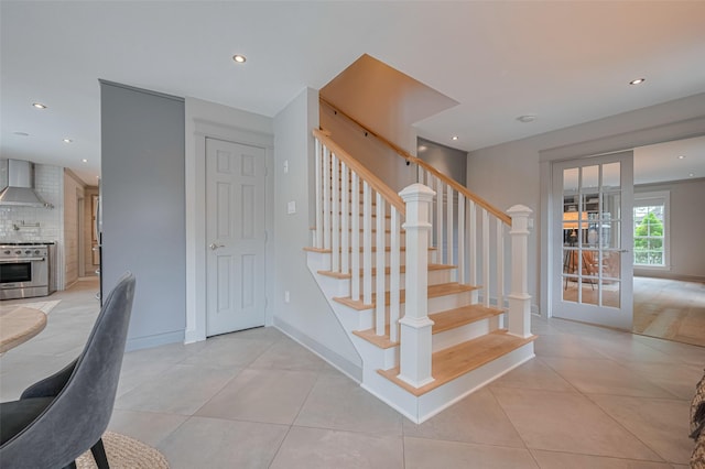 14827 River Forest Dr, Houston, TX 77079 - stairs with tile patterned flooring, recessed lighting, and baseboards