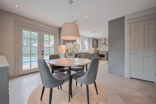 14827 River Forest Dr, Houston, TX 77079 - dining area with french doors, light tile patterned flooring, and recessed lighting