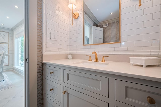 14827 River Forest Dr, Houston, TX 77079 - bathroom featuring vanity, crown molding, tile walls, decorative backsplash, and recessed lighting
