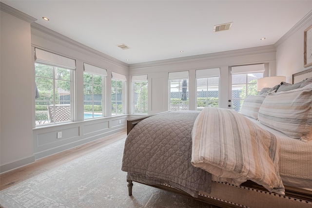 14827 River Forest Dr, Houston, TX 77079 - bedroom featuring wood finished floors, crown molding, and access to exterior