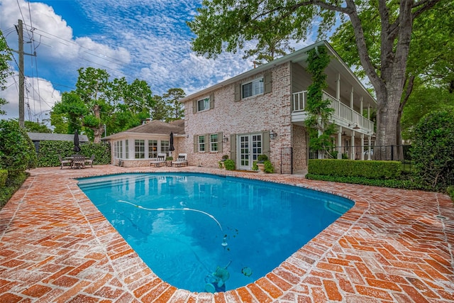 14827 River Forest Dr, Houston, TX 77079 - view of pool with a patio area, french doors, and outdoor dining space