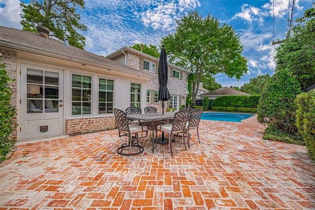 14827 River Forest Dr, Houston, TX 77079 - view of patio featuring an outdoor pool and outdoor dining area