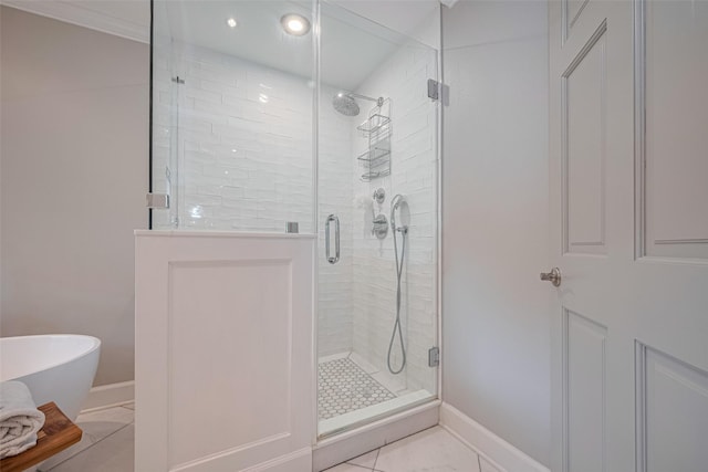 14827 River Forest Dr, Houston, TX 77079 - bathroom featuring a shower stall, baseboards, a freestanding tub, tile patterned flooring, and recessed lighting