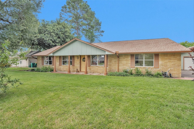 511 Northwood Dr, Conroe, TX 77303 - ranch-style home featuring a front yard, brick siding, and a shingled roof