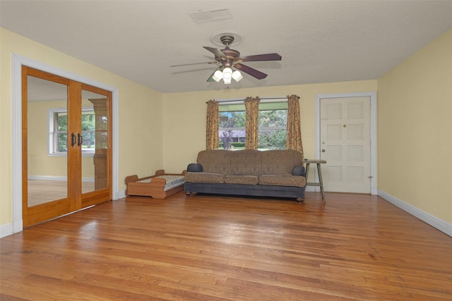 511 Northwood Dr, Conroe, TX 77303 - living room featuring light wood-style flooring, ceiling fan, and baseboards