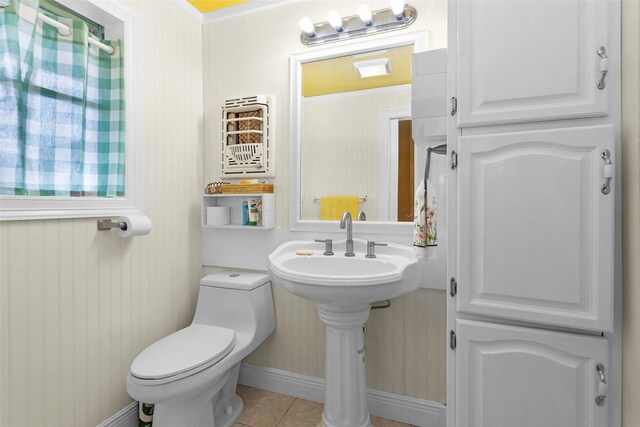 511 Northwood Dr, Conroe, TX 77303 - half bathroom with toilet, tile patterned floors, and baseboards