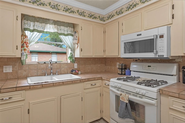 511 Northwood Dr, Conroe, TX 77303 - kitchen featuring white appliances, a sink, backsplash, and crown molding