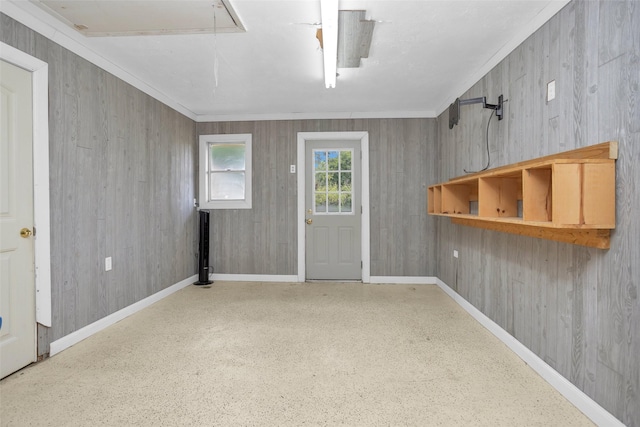 511 Northwood Dr, Conroe, TX 77303 - foyer with speckled floor, baseboards, and ornamental molding