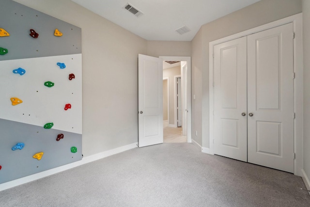 103 Catesby Ct, Conroe, TX 77304 - unfurnished bedroom featuring carpet floors, a closet, and baseboards