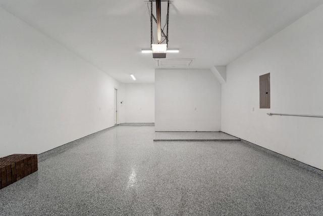 103 Catesby Ct, Conroe, TX 77304 - garage featuring electric panel and a garage door opener