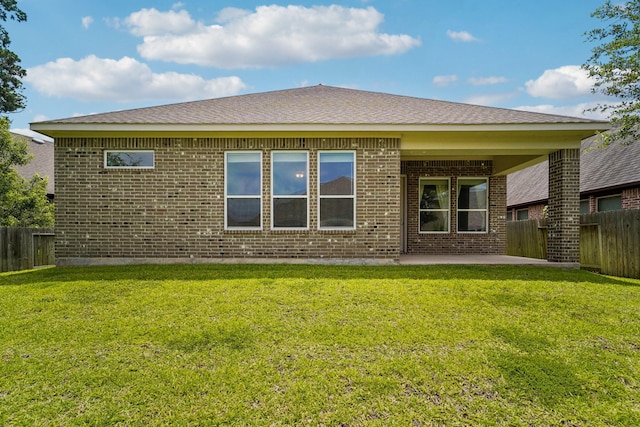 103 Catesby Ct, Conroe, TX 77304 - back of property with brick siding and a patio