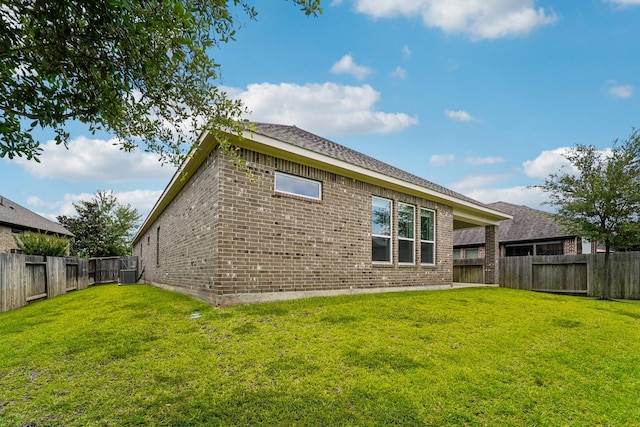 103 Catesby Ct, Conroe, TX 77304 - back of house with brick siding and central air condition unit