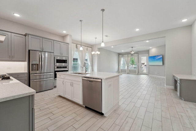 103 Catesby Ct, Conroe, TX 77304 - kitchen featuring appliances with stainless steel finishes, a sink, gray cabinetry, ceiling fan, and recessed lighting