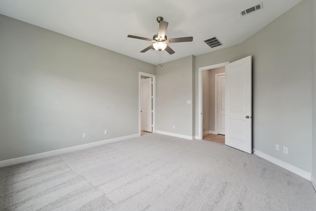 103 Catesby Ct, Conroe, TX 77304 - unfurnished bedroom featuring light colored carpet, baseboards, and a ceiling fan