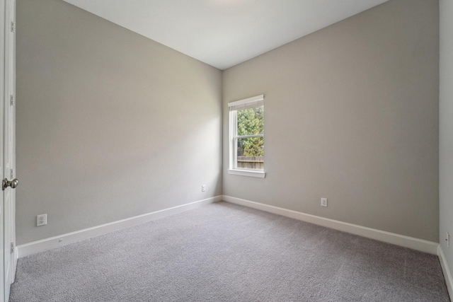 103 Catesby Ct, Conroe, TX 77304 - empty room with baseboards and light colored carpet