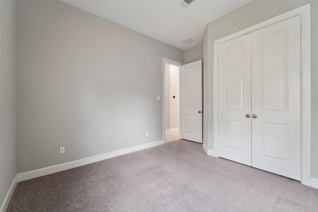 103 Catesby Ct, Conroe, TX 77304 - unfurnished bedroom featuring carpet flooring, baseboards, and a closet