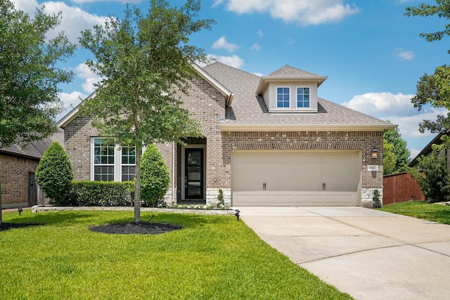 103 Catesby Ct, Conroe, TX 77304 - traditional home with brick siding, concrete driveway, a front lawn, and an attached garage